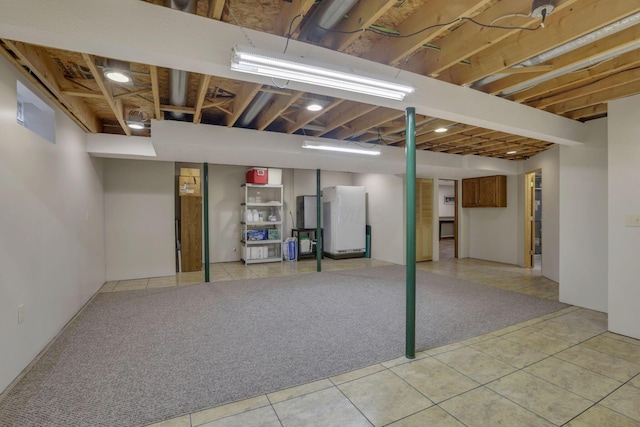7689 Godfrey Cir, Reynoldsburg, OH 43068 - finished basement with freestanding refrigerator and tile patterned floors