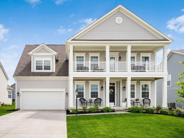 757 Avebury Dr, Pickerington, OH 43147 - view of front of property with covered porch, a balcony, concrete driveway, a front yard, and a shingled roof