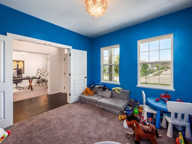 757 Avebury Dr, Pickerington, OH 43147 - game room featuring carpet, a chandelier, and wood finished floors