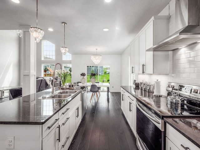 757 Avebury Dr, Pickerington, OH 43147 - kitchen with wall chimney exhaust hood, electric range, a sink, recessed lighting, and white cabinetry