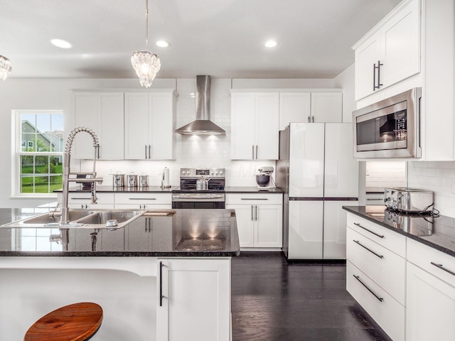 757 Avebury Dr, Pickerington, OH 43147 - kitchen featuring stainless steel appliances, wall chimney exhaust hood, a sink, white cabinetry, and recessed lighting