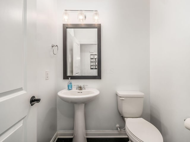 757 Avebury Dr, Pickerington, OH 43147 - bathroom with toilet, baseboards, and a sink