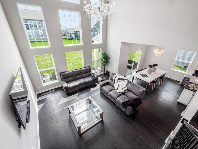 757 Avebury Dr, Pickerington, OH 43147 - living room featuring a chandelier, a high ceiling, and hardwood / wood-style floors