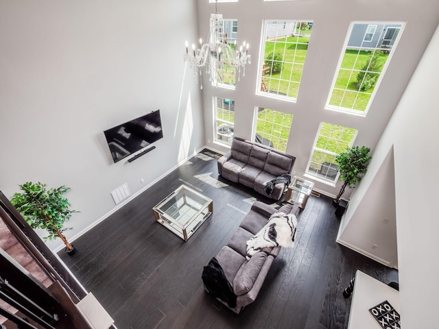 757 Avebury Dr, Pickerington, OH 43147 - living area featuring a high ceiling, hardwood / wood-style flooring, plenty of natural light, a chandelier, and baseboards