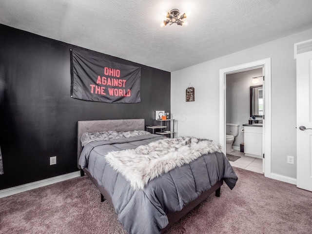 757 Avebury Dr, Pickerington, OH 43147 - bedroom with light colored carpet, a textured ceiling, ensuite bath, and baseboards