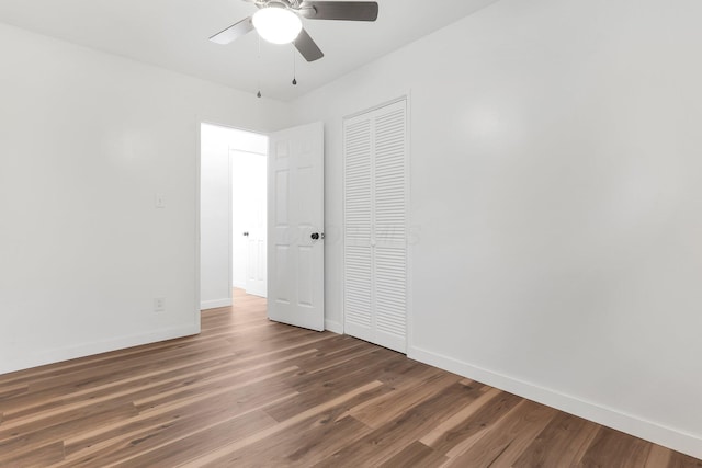 404 Stella Ave, Circleville, OH 43113 - unfurnished bedroom with baseboards, wood finished floors, a closet, and a ceiling fan