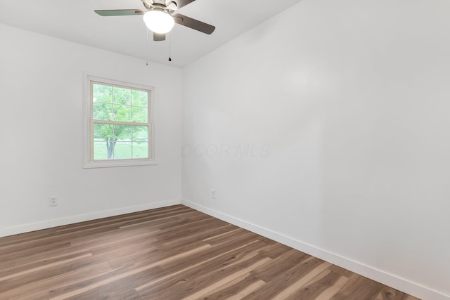 404 Stella Ave, Circleville, OH 43113 - unfurnished room with baseboards, wood finished floors, and ceiling fan