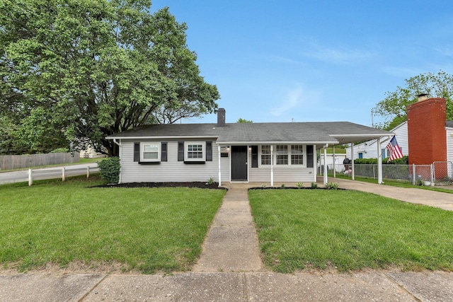 404 Stella Ave, Circleville, OH 43113 - view of front of house with concrete driveway and an attached carport