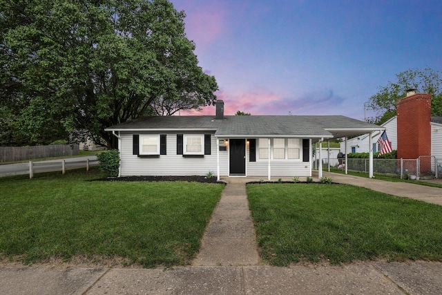 404 Stella Ave, Circleville, OH 43113 - ranch-style home featuring driveway, an attached carport, and a chimney
