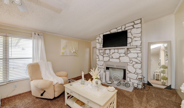 2011 Bluffstone Ct, Grove City, OH 43123 - carpeted living room with plenty of natural light, a fireplace, ceiling fan, and a textured ceiling