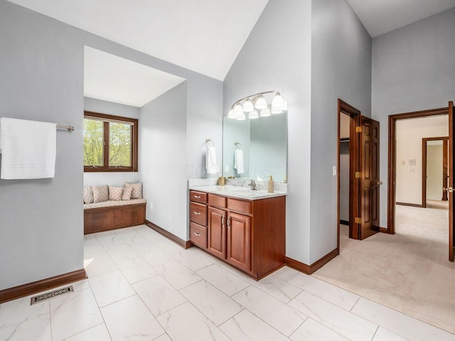full bathroom featuring baseboards, marble finish floor, vanity, and visible vents