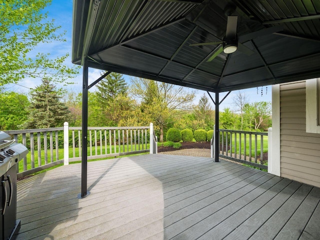 wooden terrace with a gazebo and a ceiling fan