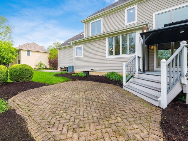 back of house with a patio area