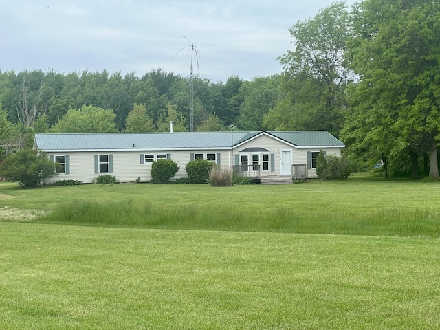 256 Mudswitch Rd, Martinsville, OH 45146 - view of front of house featuring a front yard, metal roof, and a wooded view