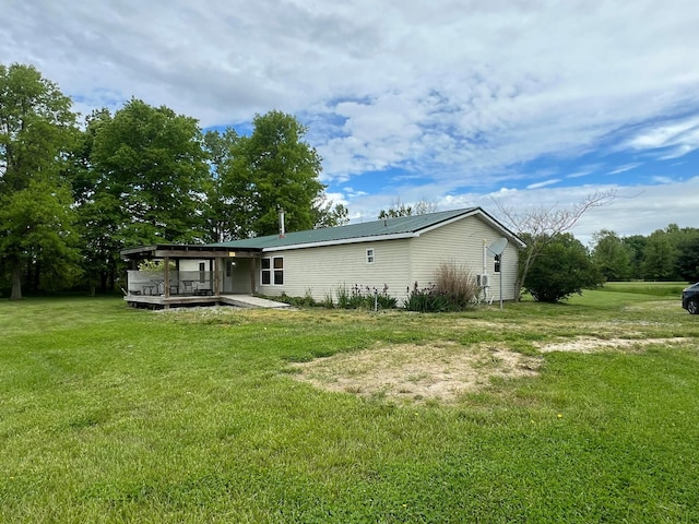 256 Mudswitch Rd, Martinsville, OH 45146 - back of house featuring a lawn, a deck, and metal roof