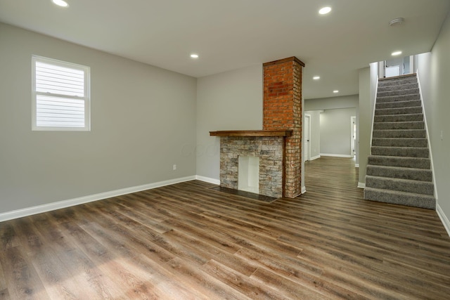 324 E Mound St, Circleville, OH 43113 - unfurnished living room with baseboards, stairs, recessed lighting, and wood finished floors