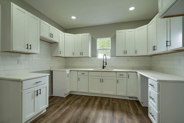 324 E Mound St, Circleville, OH 43113 - kitchen with a sink, tasteful backsplash, white cabinetry, and dark wood finished floors