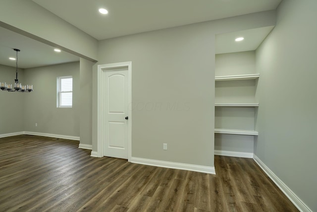 324 E Mound St, Circleville, OH 43113 - unfurnished room with a chandelier, baseboards, dark wood-style floors, and recessed lighting