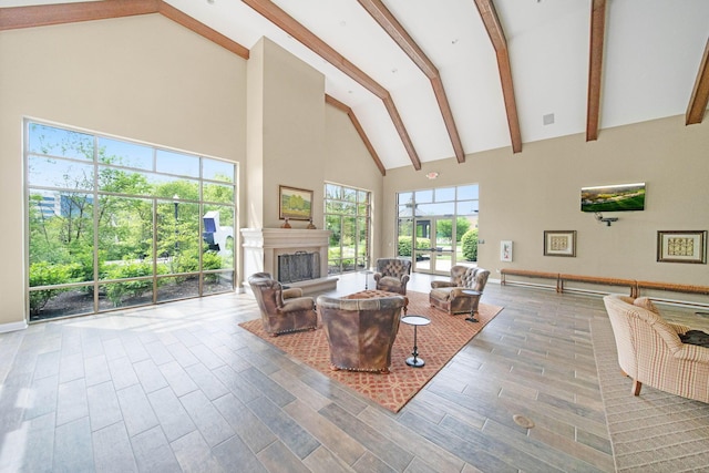 942 Perry St, Columbus, OH 43215 - living room with high vaulted ceiling, a fireplace with raised hearth, beam ceiling, and wood finished floors