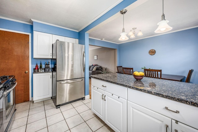 kitchen featuring light tile patterned floors, crown molding, white cabinets, and appliances with stainless steel finishes