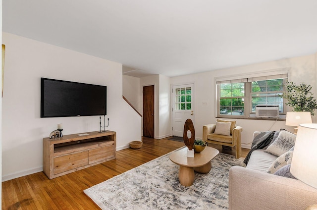 1775 NW Ct Unit 109, Columbus, OH 43212 - living room featuring wood finished floors, baseboards, and cooling unit