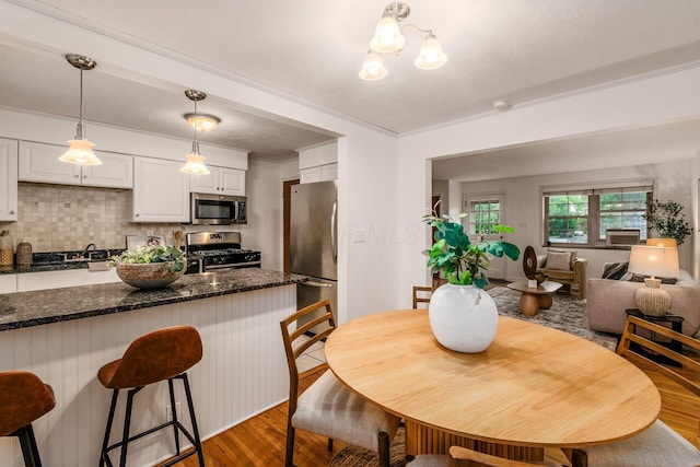 1775 NW Ct Unit 109, Columbus, OH 43212 - dining area featuring wood finished floors