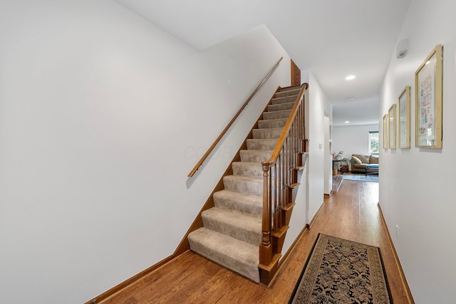 4216 Chaucer Ln, Columbus, OH 43220 - staircase featuring recessed lighting, baseboards, and wood finished floors