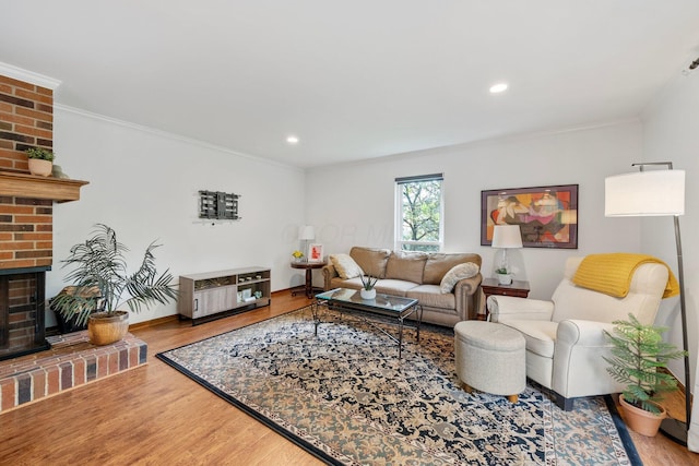 4216 Chaucer Ln, Columbus, OH 43220 - living room with wood finished floors, recessed lighting, a fireplace, crown molding, and baseboards