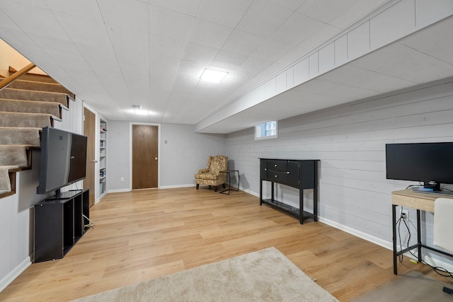 4216 Chaucer Ln, Columbus, OH 43220 - living area with stairway, baseboards, built in features, light wood-style floors, and wooden walls