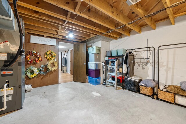 4216 Chaucer Ln, Columbus, OH 43220 - unfinished below grade area with heating unit, concrete block wall, and visible vents
