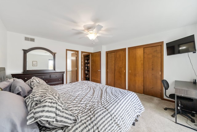 4216 Chaucer Ln, Columbus, OH 43220 - bedroom featuring multiple closets, light carpet, ceiling fan, and visible vents