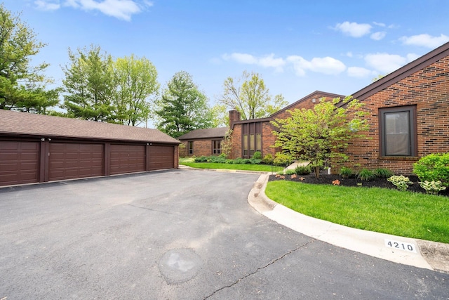 4216 Chaucer Ln, Columbus, OH 43220 - exterior space with community garages and an outbuilding