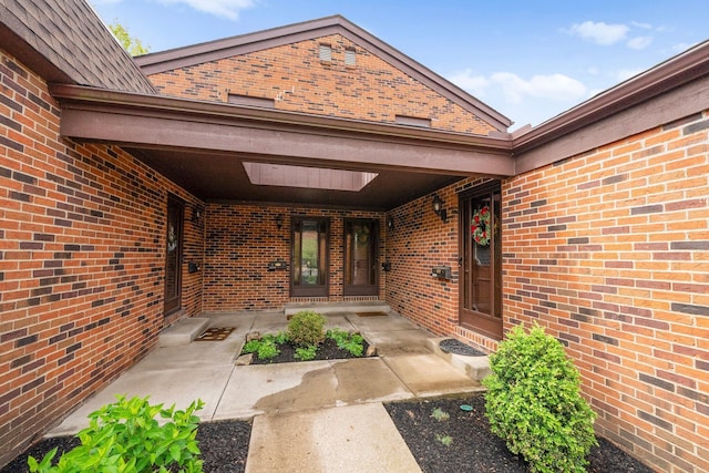 4216 Chaucer Ln, Columbus, OH 43220 - view of exterior entry with a porch and brick siding