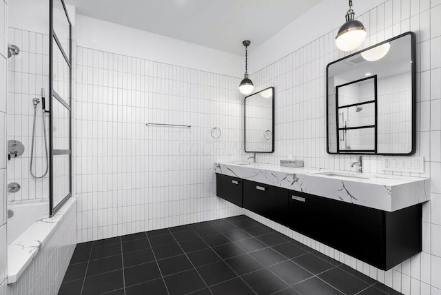 250 W Spring St Unit 1114, Columbus, OH 43215 - full bath featuring tile walls, tile patterned flooring, tiled shower / bath combo, and double vanity