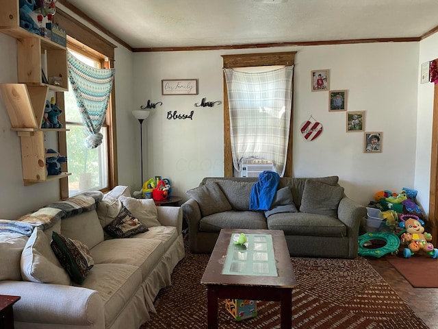 living area featuring cooling unit and crown molding