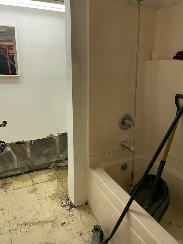 bathroom featuring washtub / shower combination