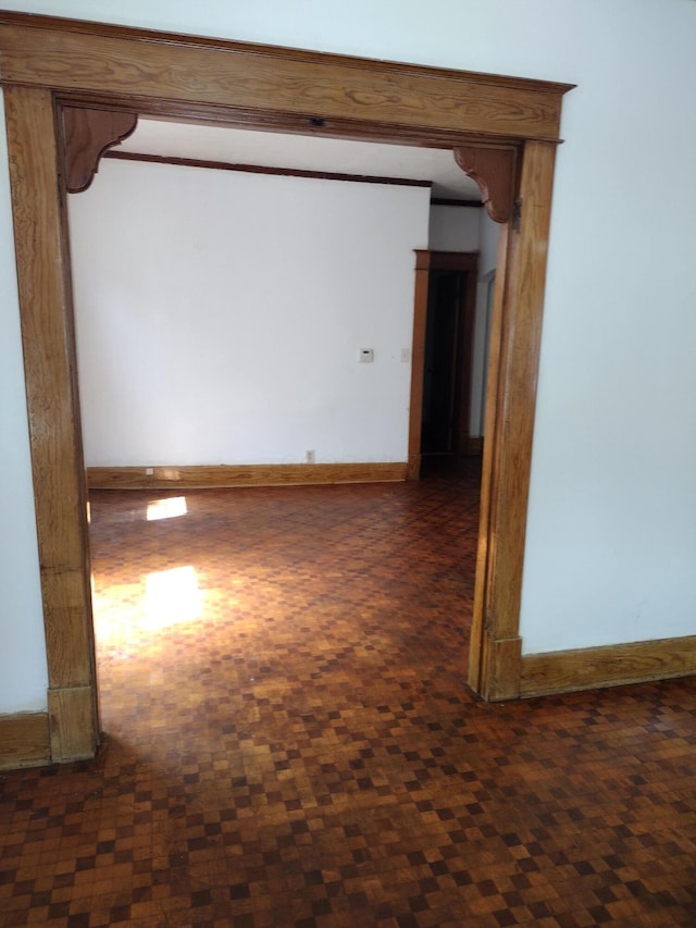 spare room featuring baseboards