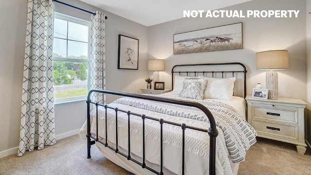 bedroom featuring baseboards and carpet flooring