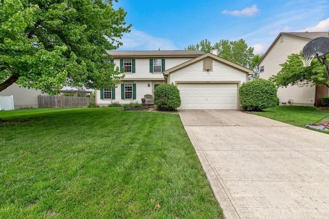 traditional-style house featuring an attached garage, driveway, fence, and a front yard