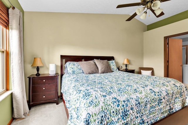 carpeted bedroom featuring lofted ceiling and ceiling fan