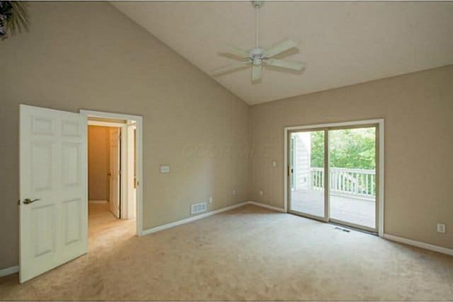 1139 Cross Creeks Rdg, Pickerington, OH 43147 - empty room featuring light colored carpet, ceiling fan, baseboards, and high vaulted ceiling