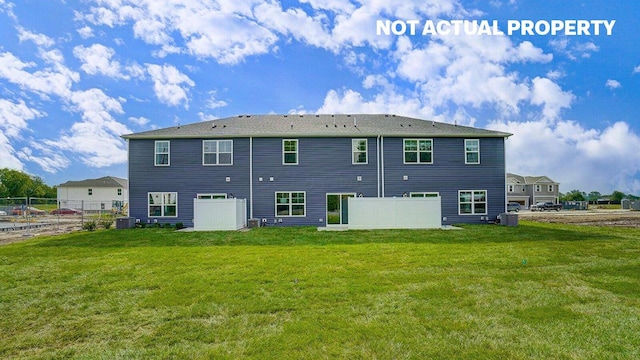6360 Ripken St, Columbus, OH 43228 - back of house with fence and a lawn