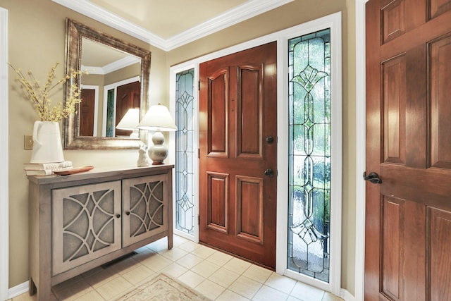 entryway featuring crown molding, light tile patterned floors, and baseboards