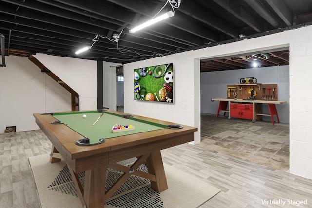game room featuring light wood-style floors, billiards, and concrete block wall