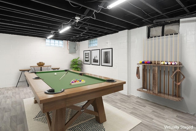 rec room with light wood-style floors, pool table, and electric panel