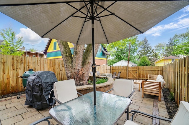 931 Dennison Ave, Columbus, OH 43201 - view of patio featuring a fenced backyard, an outdoor living space, and outdoor dining space