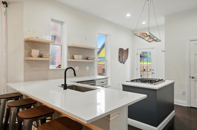 931 Dennison Ave, Columbus, OH 43201 - kitchen featuring recessed lighting, a sink, open shelves, a kitchen island, and tasteful backsplash