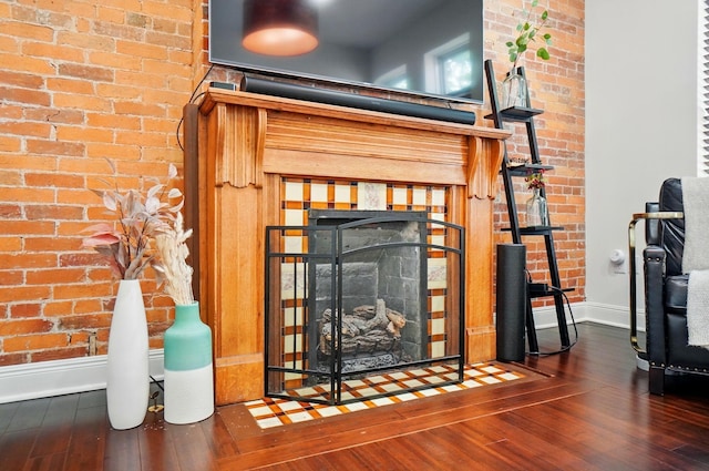 931 Dennison Ave, Columbus, OH 43201 - interior details featuring a fireplace, baseboards, and wood finished floors