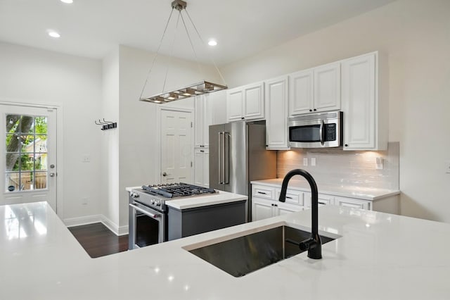 931 Dennison Ave, Columbus, OH 43201 - kitchen with a sink, dark wood-type flooring, decorative backsplash, a center island, and high quality appliances