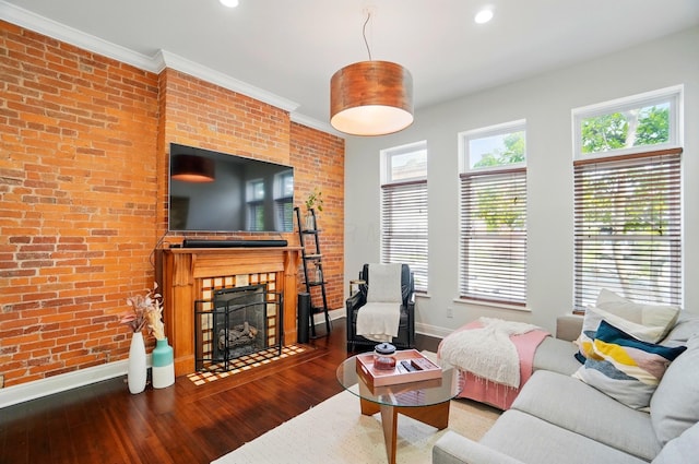 931 Dennison Ave, Columbus, OH 43201 - living area featuring baseboards, brick wall, a fireplace with flush hearth, and wood finished floors